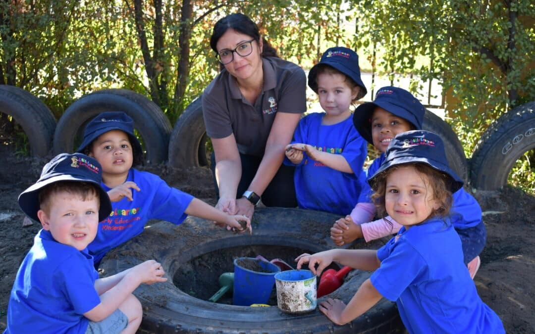 Stephanie with children/mud play